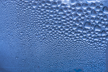 Blue water drops macro detail or close-up background