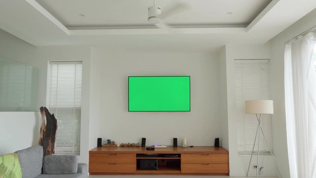 LCD TV With Green Screen On The Wall In Modern Living Room With Spinning Ceiling Fan