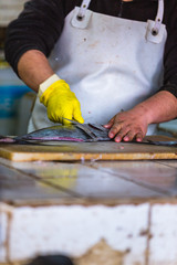 A man cleaning a fish
