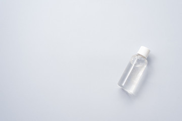 Gel sanitizer in a plastic bottle on a blue background. Coronavirus protection