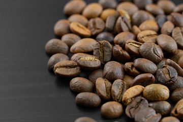 Coffee beans on a dark background macro