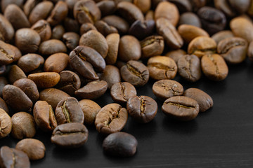 Coffee beans on a dark background macro