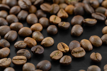 Coffee beans on a dark background macro