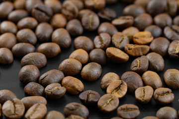 Coffee beans on a dark background macro