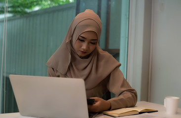 Young Muslim business woman doing work ,serious feeling,office busy time