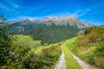 In the mountains near the Austrian village Nauders, many hiking paths can be found. It's located in the state of Tirol near Italy (connected by the Resia Pass) and the canton Graubünden in Switzerland