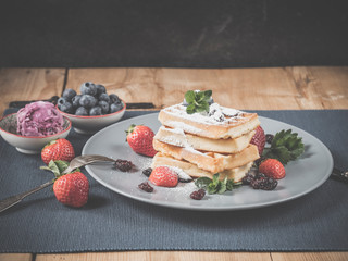 waffle stack with blueberry & strawberry topping and ice cream