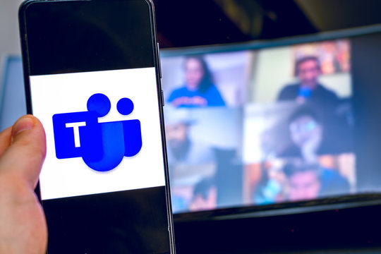 Hand Use Videoconference App Icon Of Microsoft Teams On Smartphone.