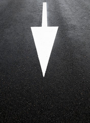 White arrow on the road.