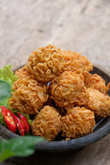 crispy noodle balls served on bowl, also known as bola bola mie