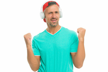 Music makes me happy. Happy man listen to music isolated on white. Handsome guy make winner gesture. Happy music. Fun and entertainment. Happy new mix. Pleasure and joy. Super hit