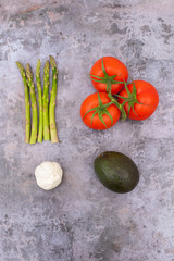 Avocado, Asparagus, Tomato and Garlic Photo with Dark Background