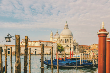 Fototapeta na wymiar Grand Canal and Basilica Santa Maria della Salute with gondolas, Venice, Veneto, Italy. vintage toning
