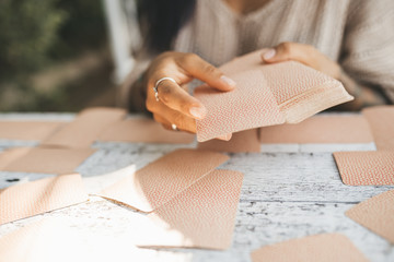 Close uo of female hands with Tarot cards