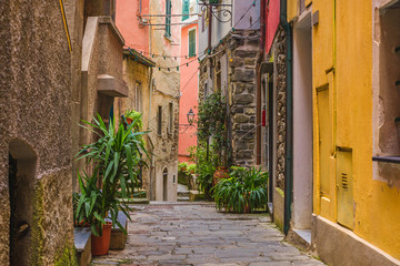 Fototapeta na wymiar Old medieval street in Italian town Vernazza with nobody on Cinque Terre coast, Liguria, Italy