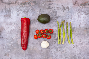 Red Pepper, Garlic, Avocado, Asparagus and Cherry Tomatoes Photo with Dark Background