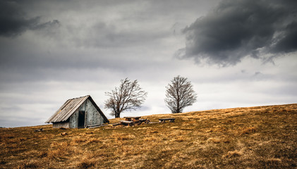 Old wooden shelter in mountain carpathian landscape Brenna Poland