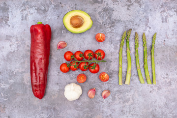 Red Pepper, Avocado, Garlic, Asparagus and Tomatoes Photo with Dark Background