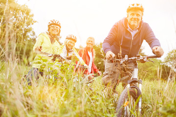 Group of seniors with bicycle bike tour