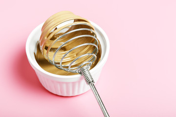  The process of making dalgona coffee on a pink background