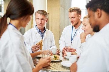 Doctors eat in the hospital canteen