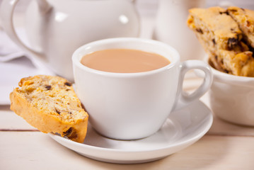 Italian biscotti and cup of coffee with milk. Close up.