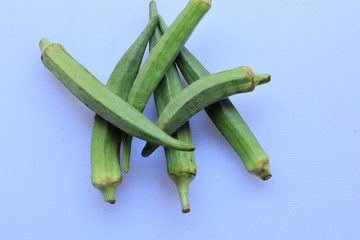 Fresh Young Lady Fingers or Okra in white background
