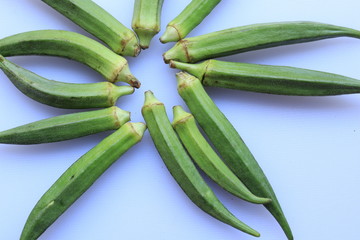 Fresh Young Lady Fingers or Okra in white background

