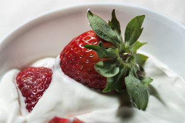 Strawberries and yogurt ready to eat.