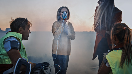 Team of Paramedics Perform Emergency First Aid to Injured Young Girl. Giving Oxygen Mask and Checking for Injuries. Car Crash Traffic Accident