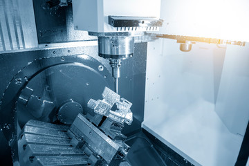 The  5 axis CNC milling machine cutting the  automotive parts with solid ball endmill tools. The...