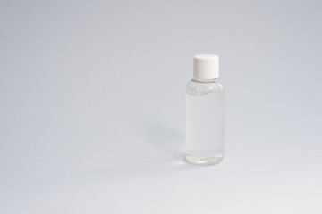 Fototapeta na wymiar Gel sanitizer in a plastic bottle on a blue background. Coronavirus protection