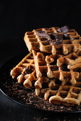 Belgian, french waffles for breakfast.  On a dark background