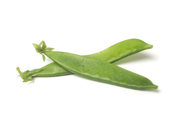 Closeup of organic flat green beans on white background