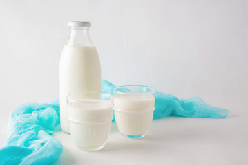 Fermented dairy product kefir drink or yogurt with probiotics on a white background.