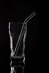 Empty glass silhouette isolated on dark background