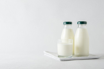 Kefir drink with on the white wooden background with copy space