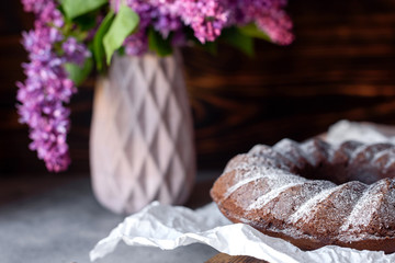 Round chocolate coffee cupcake with raisins and poppy