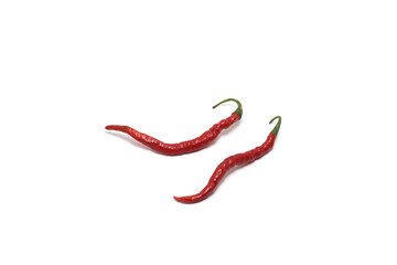 Two curly red chillies (Capisicum annuum) top high angle isolated on white background