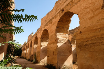 The ancient ruined arches of the massive Royal Stables, Meknes in Morocco. - obrazy, fototapety, plakaty