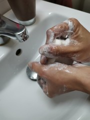 Fototapeta premium washing hands in bathroom