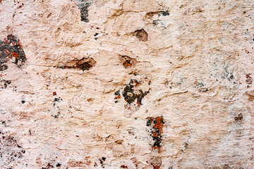 Texture of a concrete wall with cracks and scratches which can be used as a background