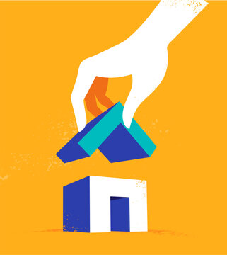 La mano che completa l'edificio mettendo sopra il tetto