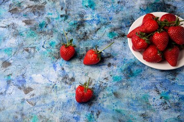 red strawberries on a blue background