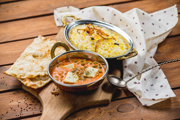 Traditional indian cuisine naan curry masala biryani rice kitchen towel panir