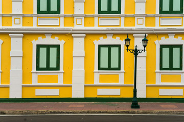 Old classical yellow building facade in Bangkok Thailand.