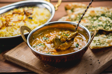 Traditional indian cuisine naan curry masala biryani rice kitchen towel panir