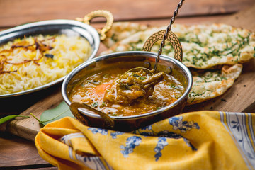 Traditional indian cuisine naan curry masala biryani rice kitchen towel panir