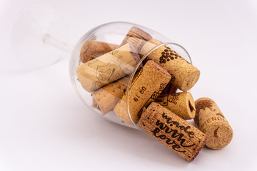 Lying wine glass filled with cork