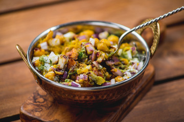 samosa chat masala spoon dish wooden board traditional indian cuisine